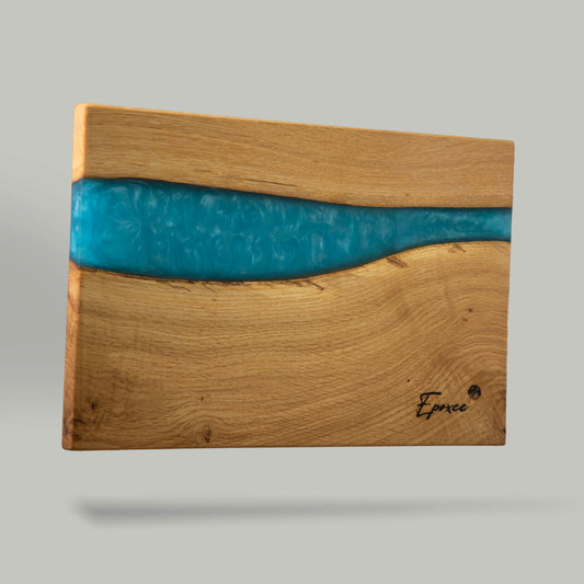 Serving board from wood made with epoxy resin in the color caribic blue