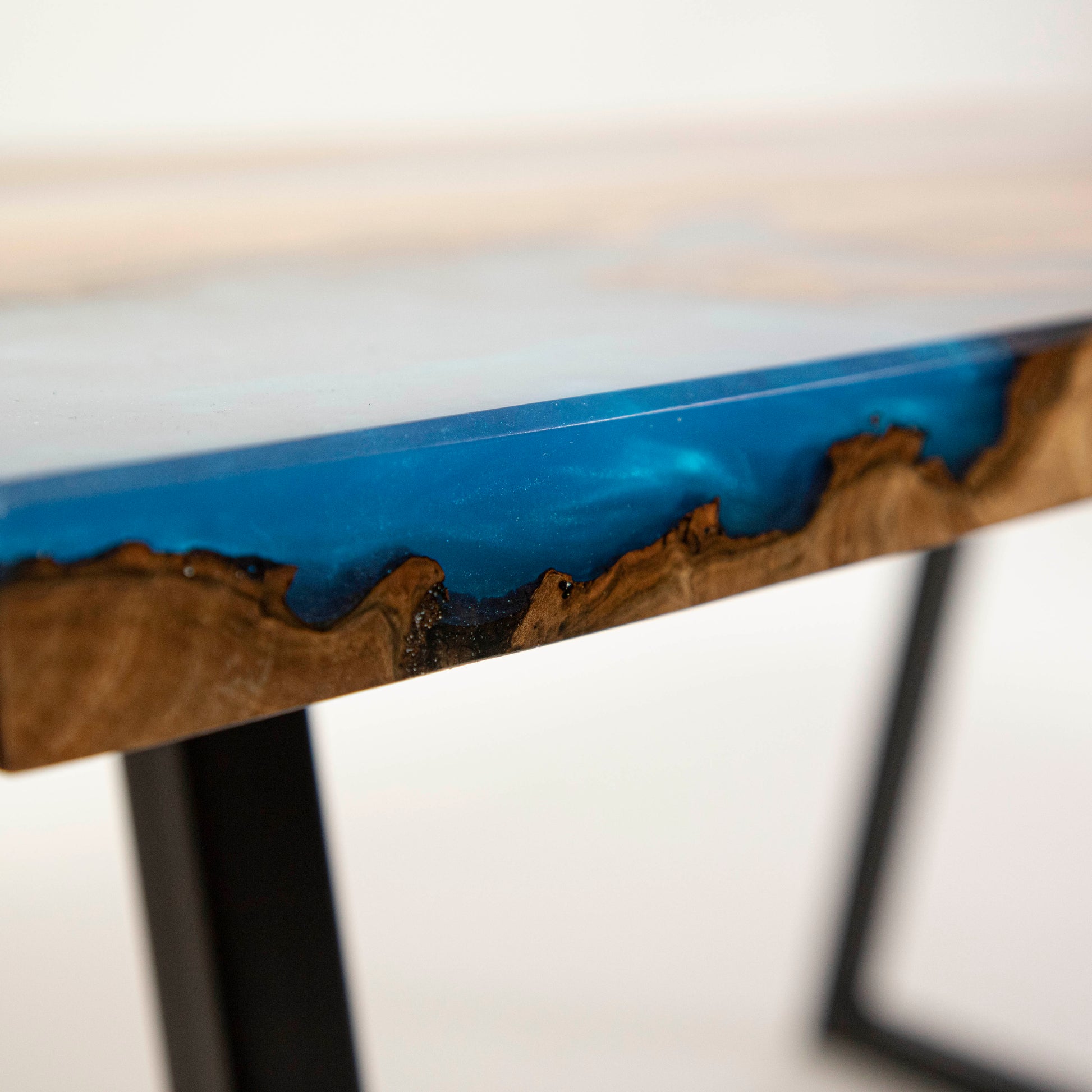 Coffee table made from wood and epoxy resin in the color classic blue