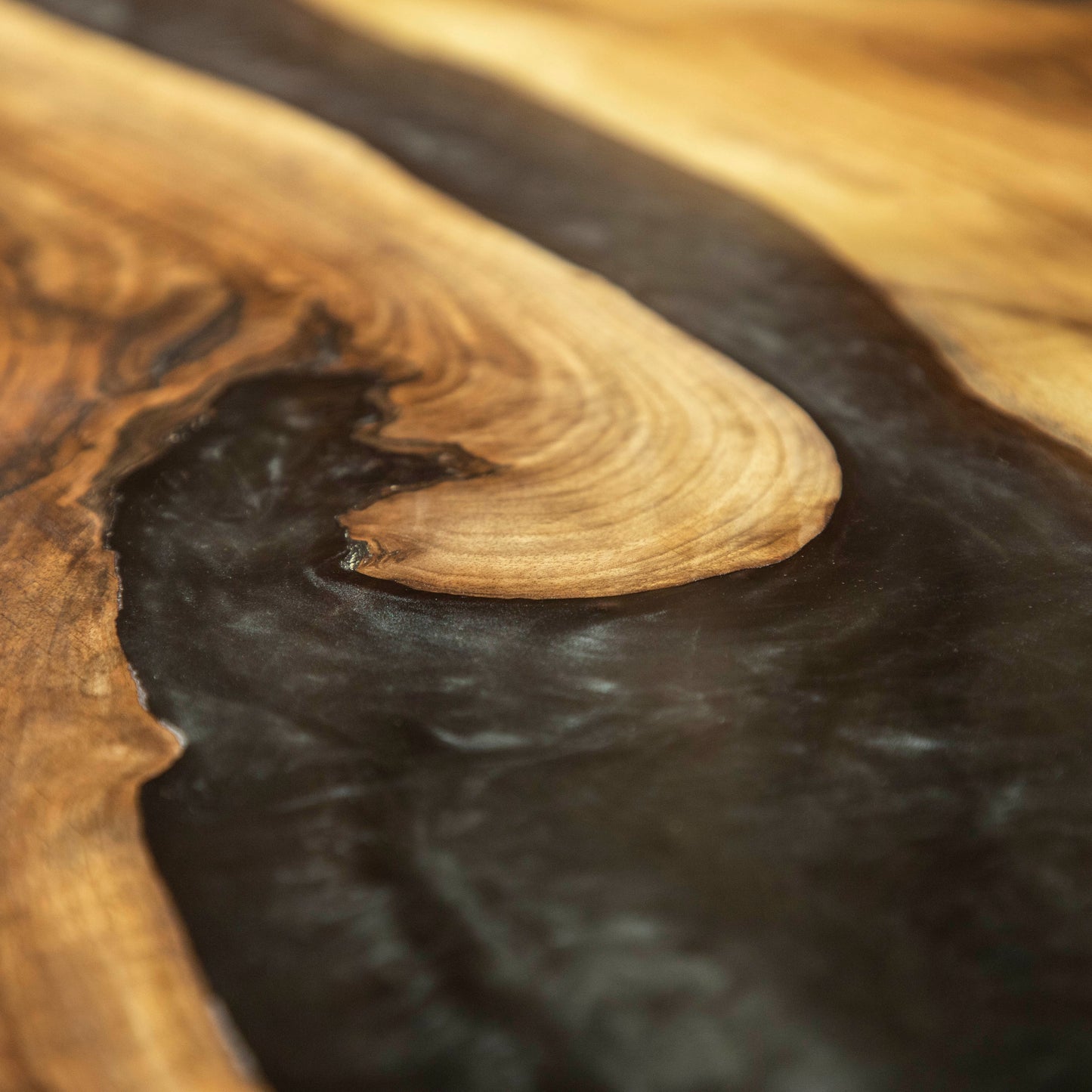 Adjustable desk made from wood and epoxy resin in the color saturn