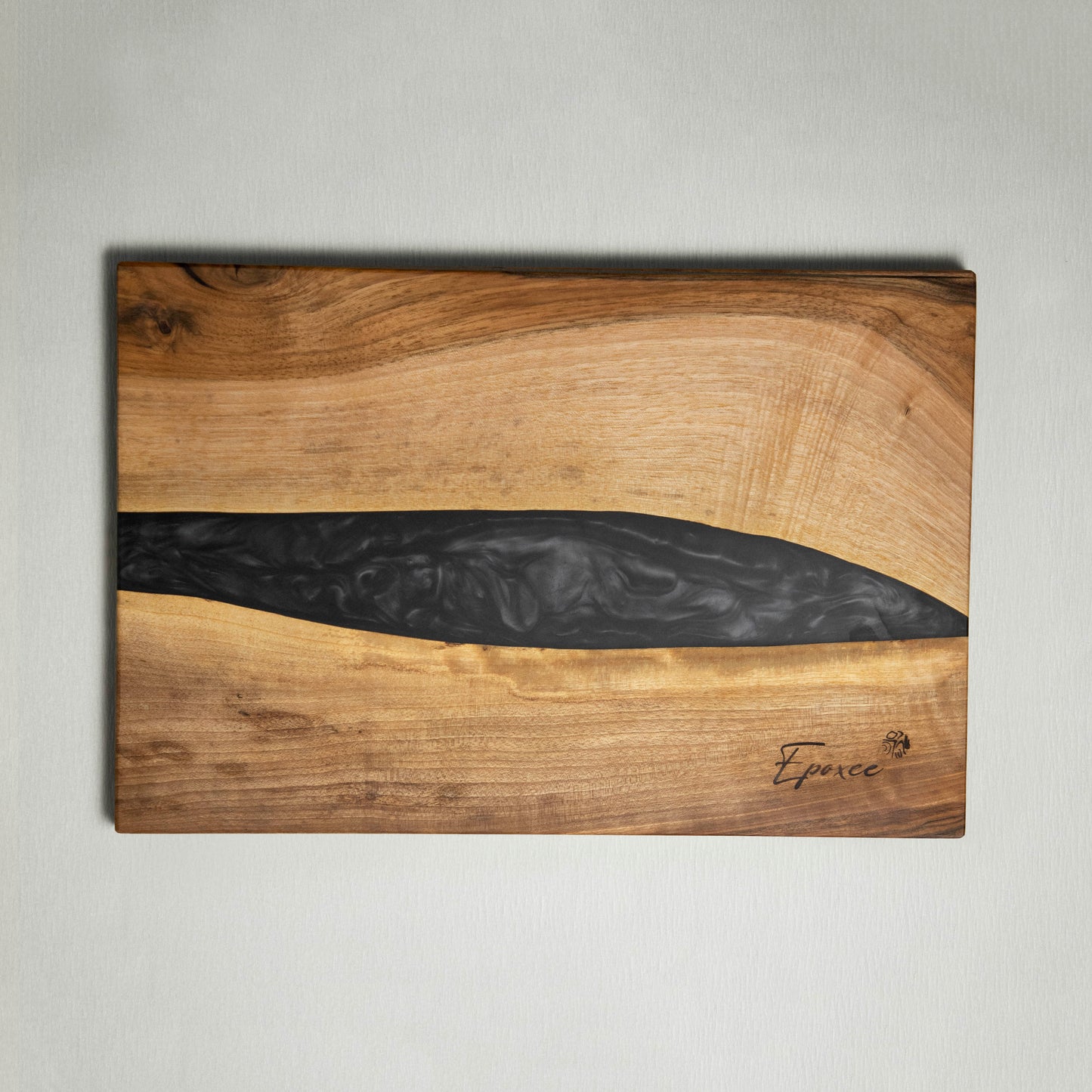 Serving board made from wood and epoxy resin in the color gun powder