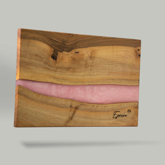 Serving board made from wood and epoxy resin in the color rose quartz