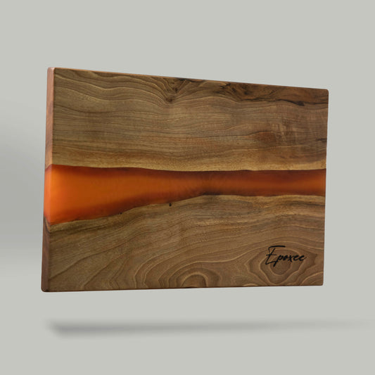 Serving board made from wood and epoxy resin in the color siena orange