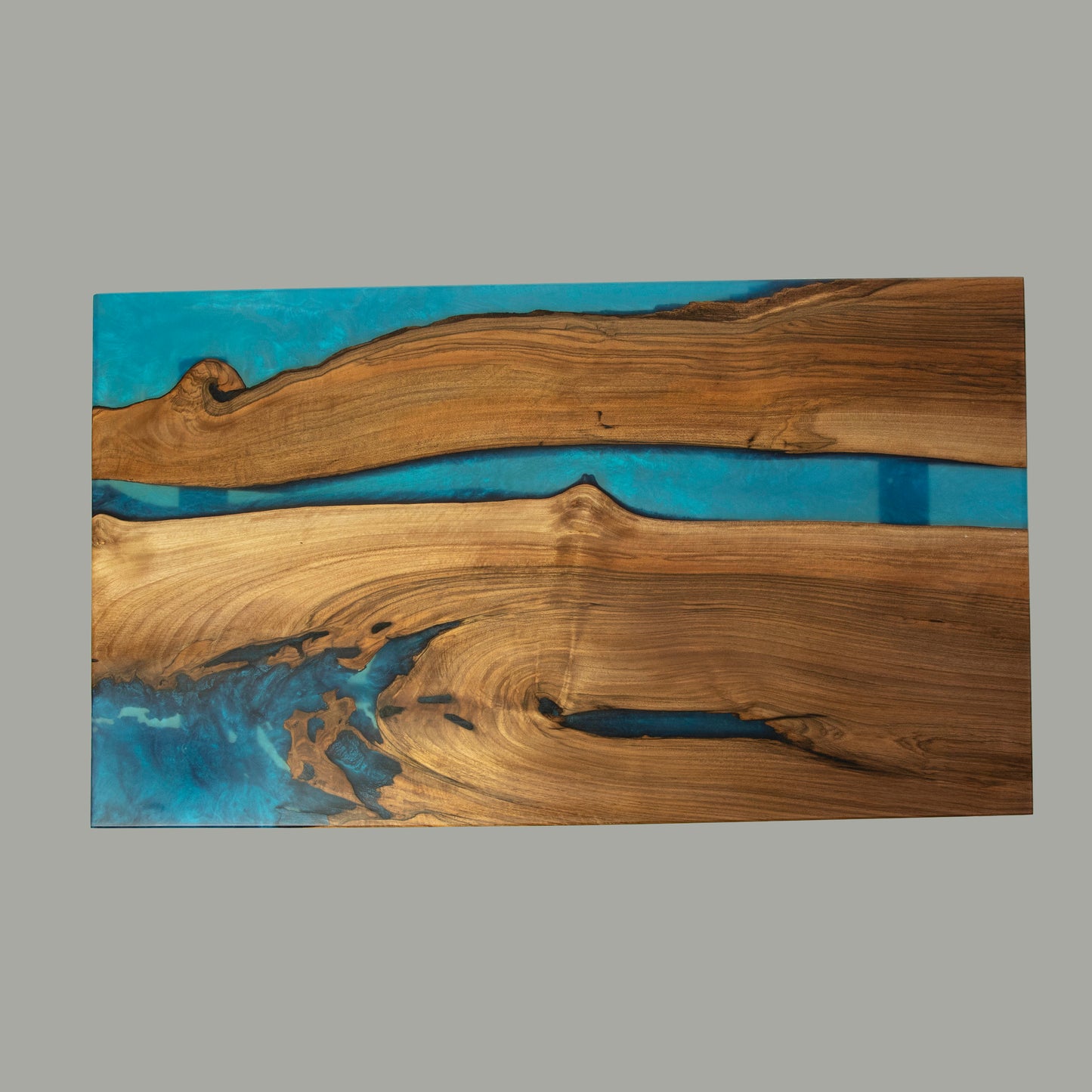 Coffee table made from wood and epoxy resin in the color classic blue