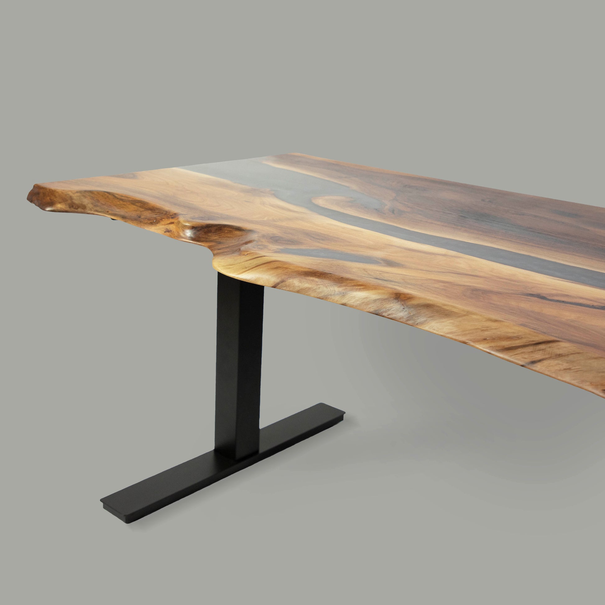 Adjustable desk made from wood and epoxy resin in the color saturn