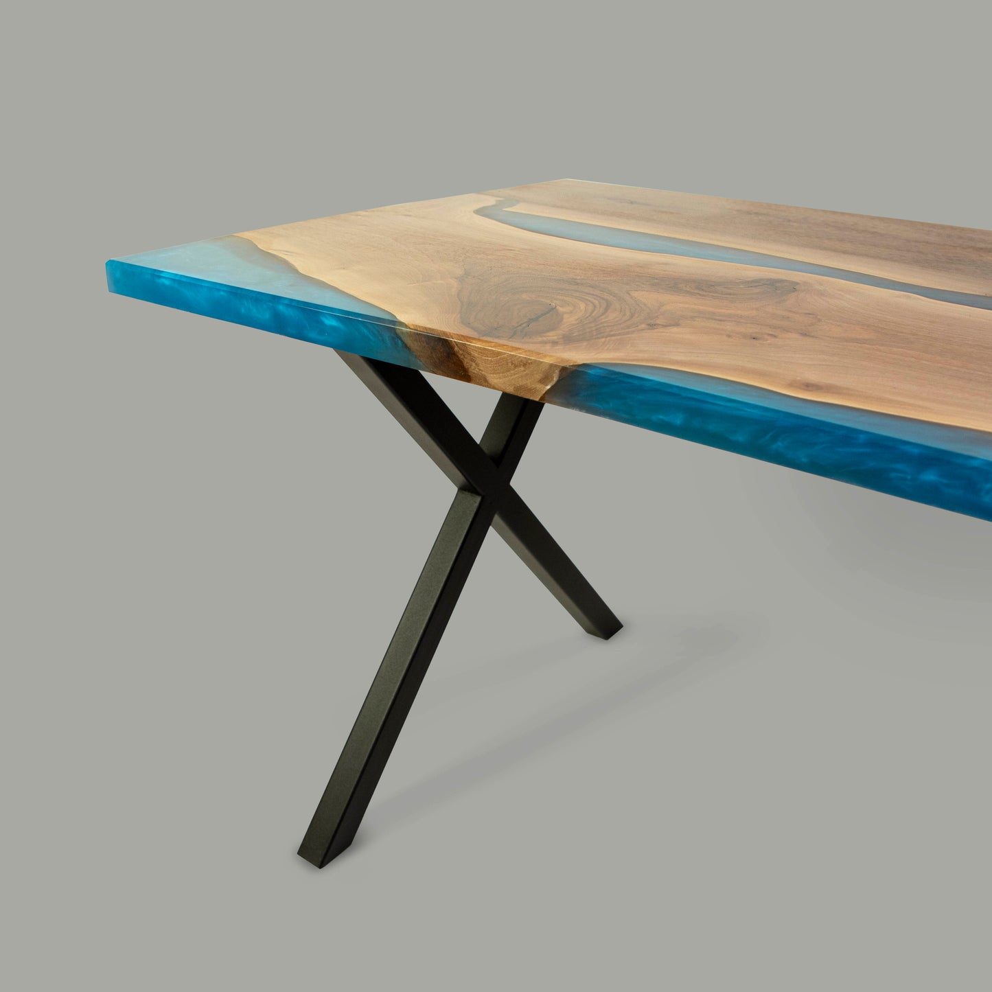 Dining table made from wood and epoxy resin in the color classic blue