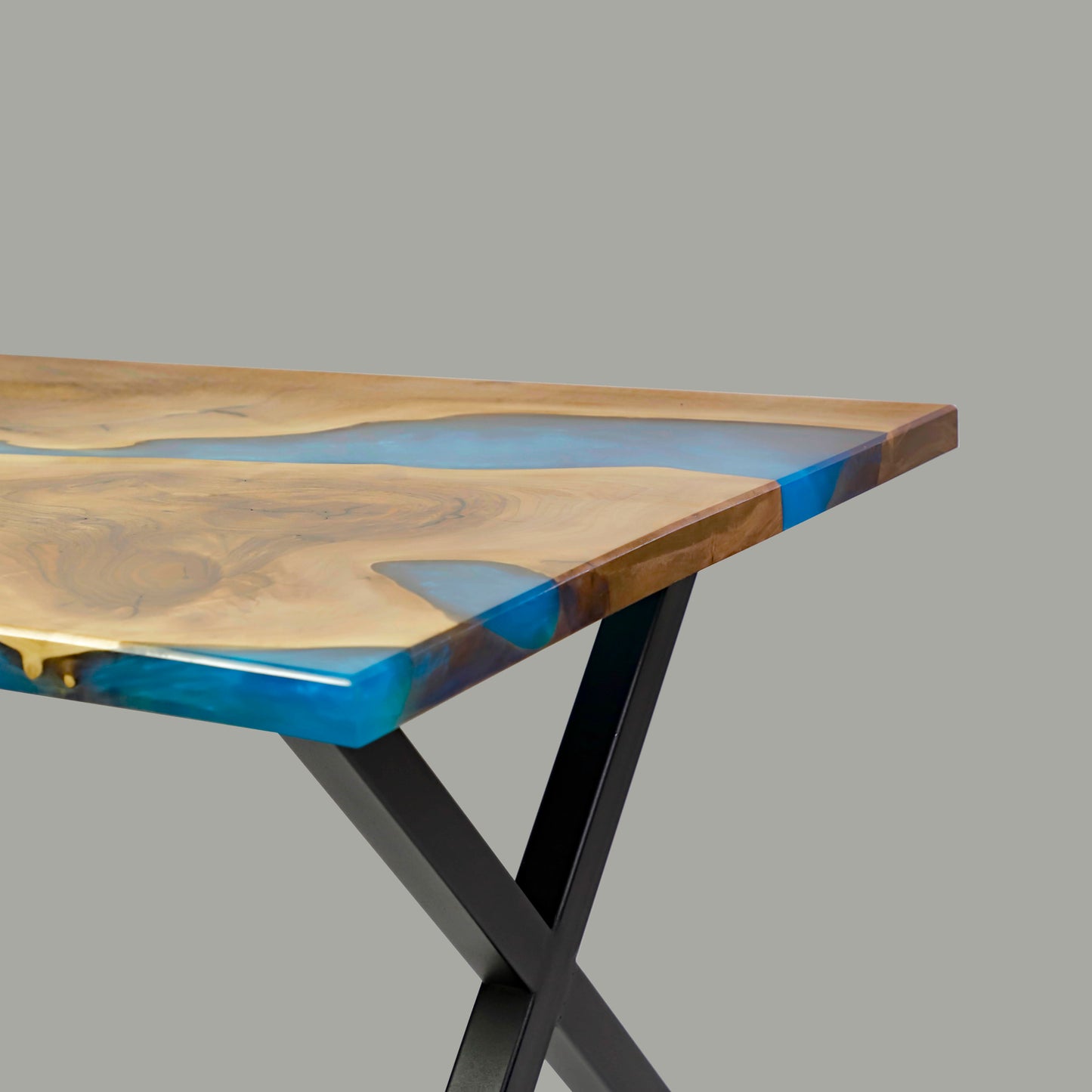 Dining table made from wood and epoxy resin in the color classic blue