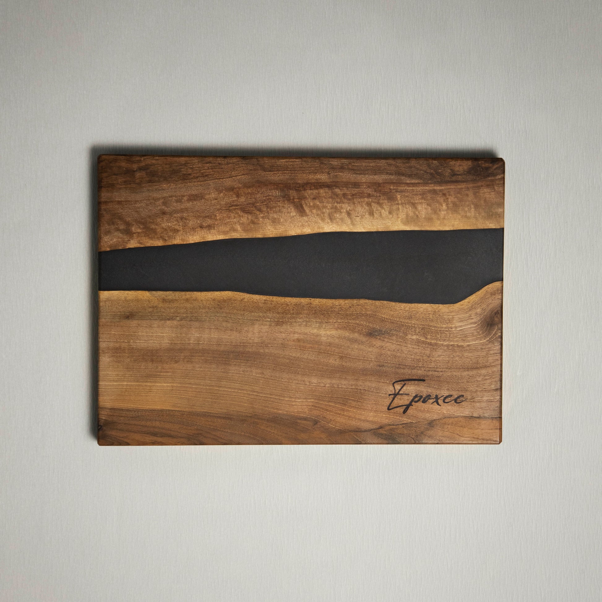 Serving board made from wood and epoxy resin in the color gun powder