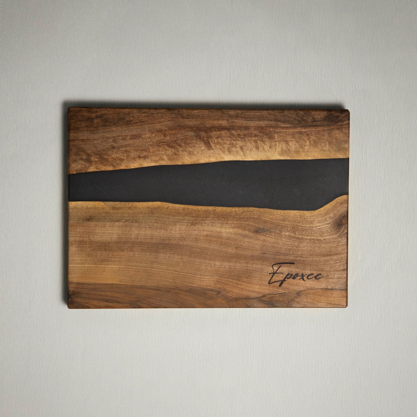 Serving board made from wood and epoxy resin in the color gun powder