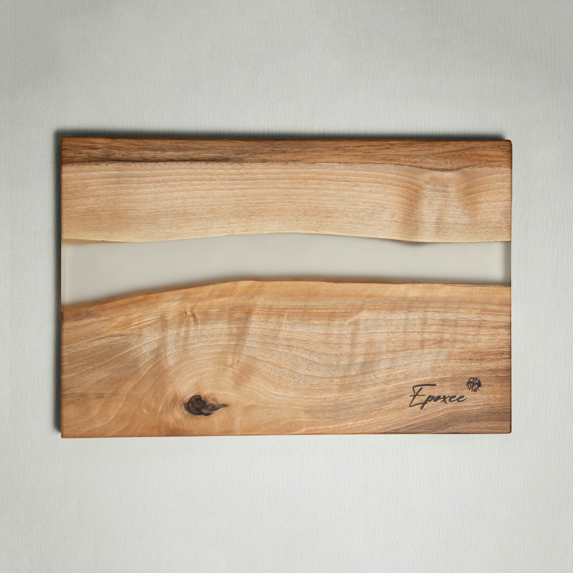 Serving board made from wood and epoxy resin in the color smoky crystal
