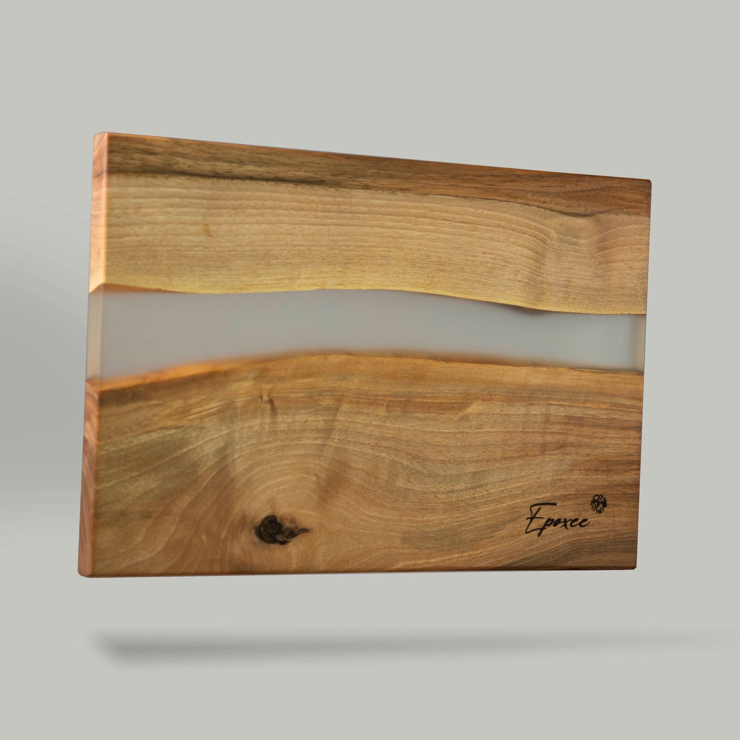 Serving board made from wood and epoxy resin in the color smoky crystal